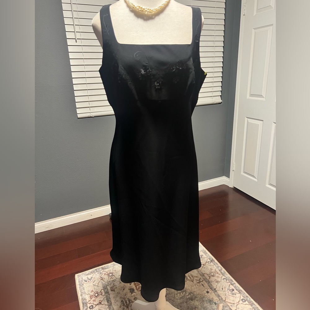 Little Black Sleeveless Dress with Appliques and Flowy Bottom. Size 14